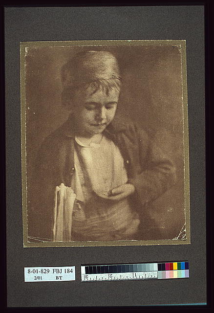Newsboy looking at coins in his hand, half-length portrait: Johnston (Frances Benjamin) Collection, Prints &amp; Photographs Division, Library of Congress, LC-USZC2-6095
